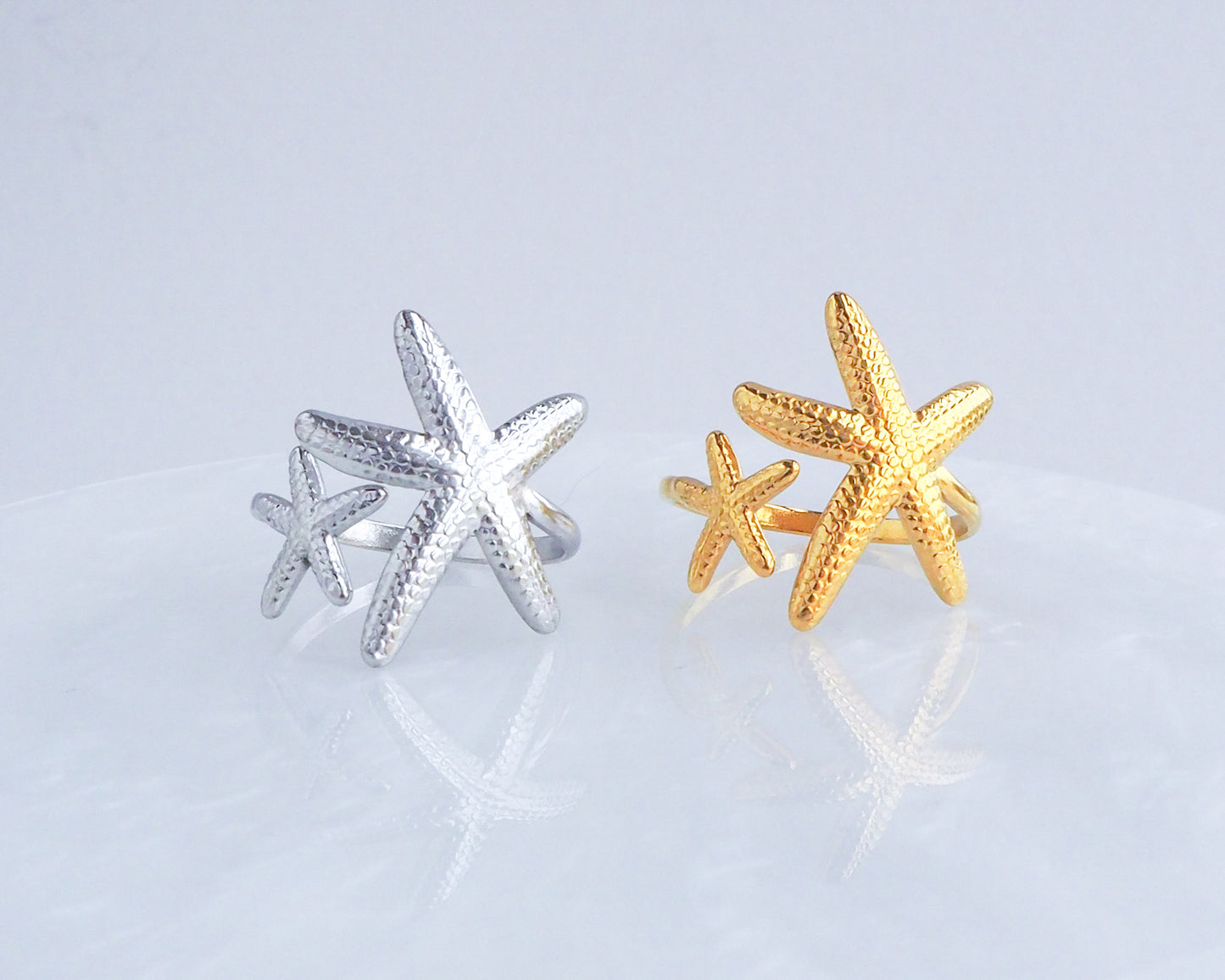 Silver and Gold Starfish Sea Star Rings on display