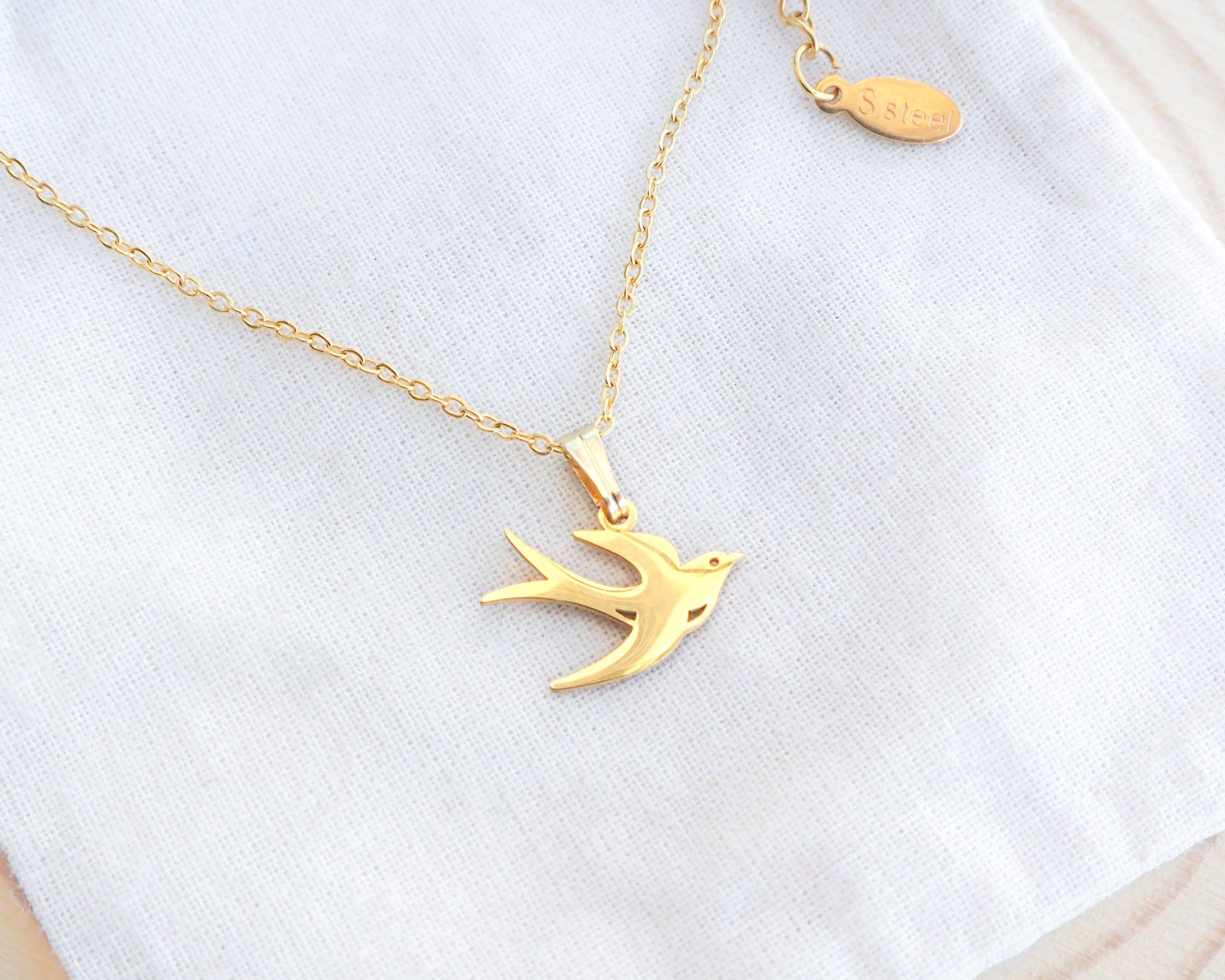 Portuguese Swallow Bird Andorinha Gold Necklace on display