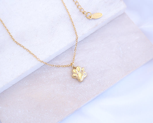 Tiny Cat Paw Gold Necklace on stone displayed, Memory Cat Jewelry, Gold Cat Necklace