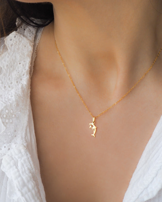 Dainty Tiny Orca Necklace from Portugal on neck model