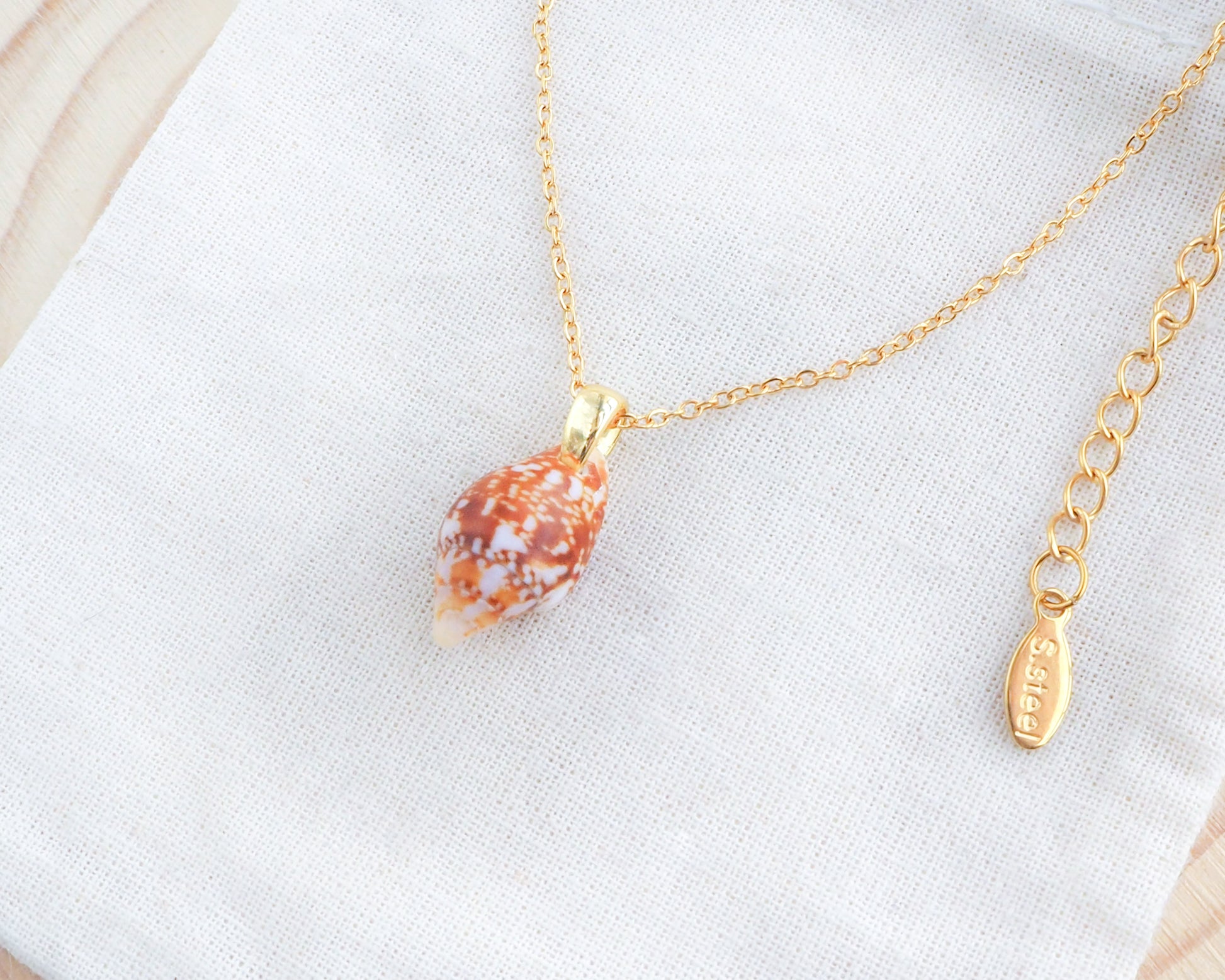 Tiny Rustic Dove Shell Gold Necklace, Tiny shell from Portugal on display