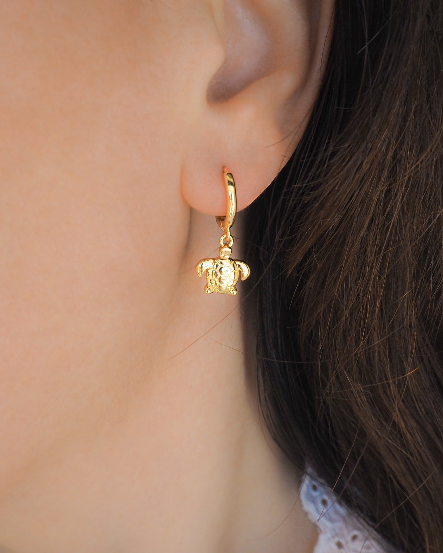 Gold Tiny Turtle Hoop Earring close up in ear model, 14k gold vermeil 925 sterling silver tiny ocean earrings, beach girl jewelry, sea by lou, mix and match beach earrings