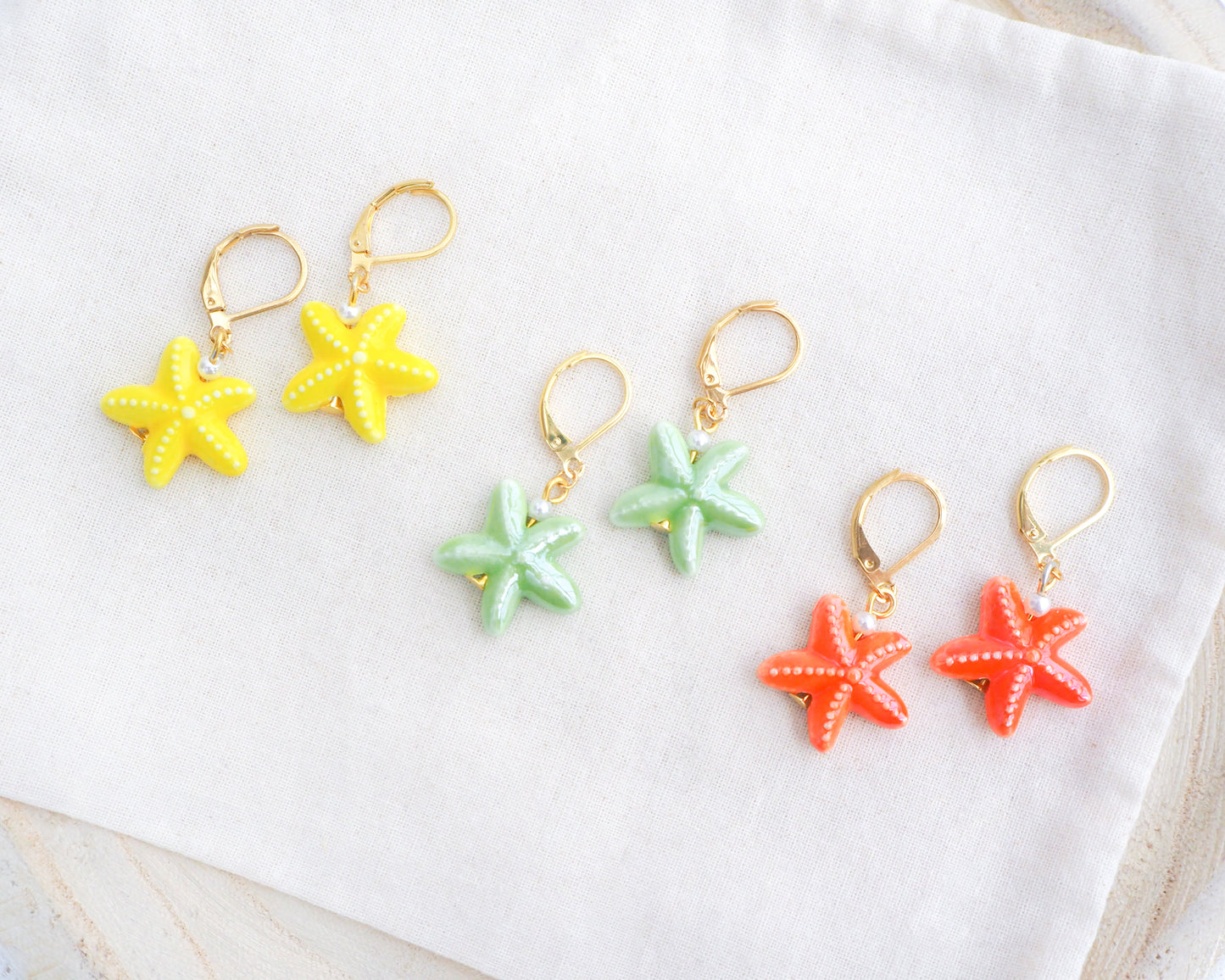 Mix of Ceramic Starfish Gold Earrings on display, Yellow Green Orange Sea Star Summer earrings