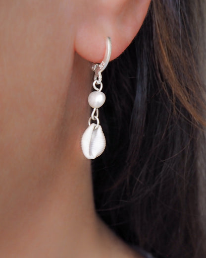 Model wearing Cowrie Shell Pearl Earrings from Portugal, Freshwater pearls with real Kauri shells