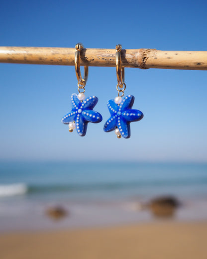 Blue Ceramic Starfish Sea Star Gold Earrings with ocean background, Handmade Ceramic Sea Star Earrings from Portugal