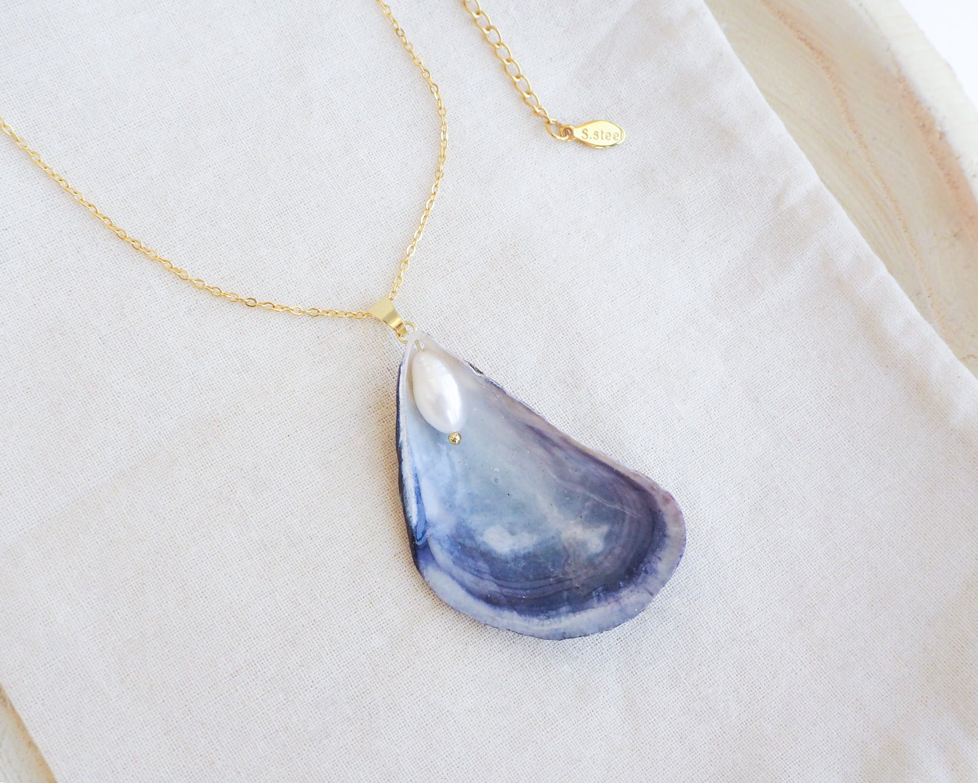Close up of Blue Mussel Pearl Gold Necklace displayed, Gold Pearly Mussel Shell Necklace, Mussel Pearly Shell handpicked from Portugal, Sea by Lou, Mother of Pearl Shell Portugal 