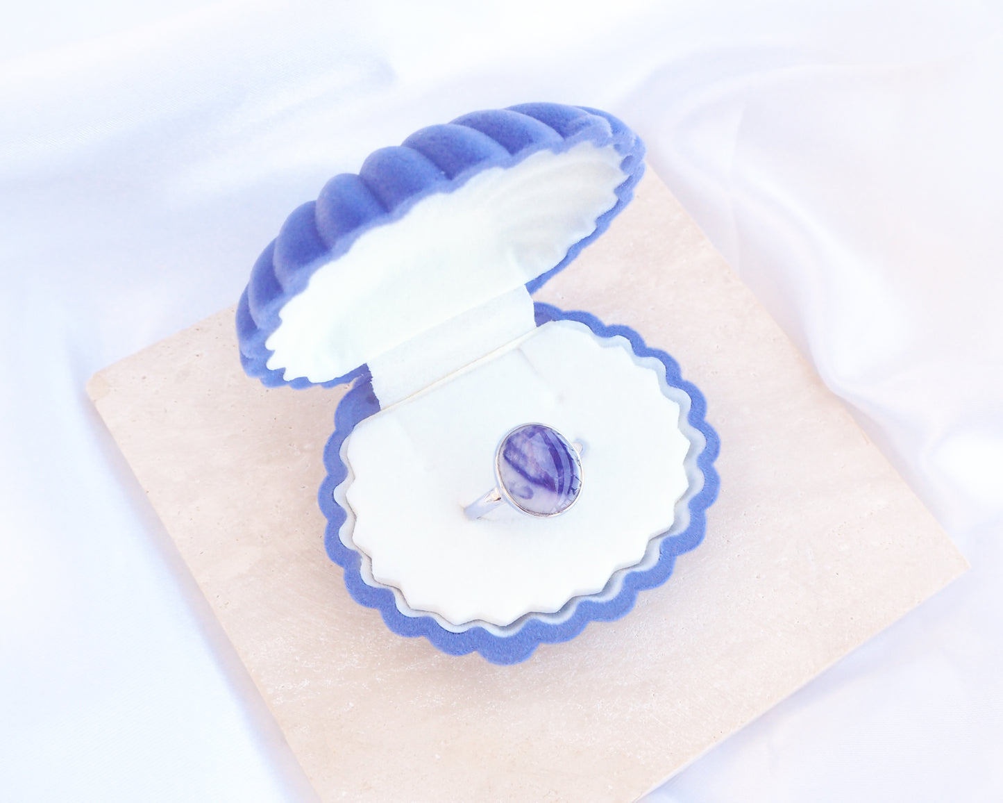 Blue Velvet Seashell Jewelry Box with Mussel Shell Ring, Shell shaped jewelry box blue velvet seashell jewellery box on stone displayed 