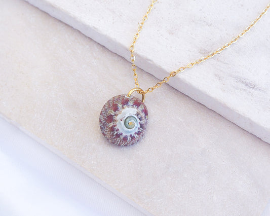 Bordeaux Green Patterned Flat Top Shell Gold Necklace on stone displayed, Flat Topshell from Portugal