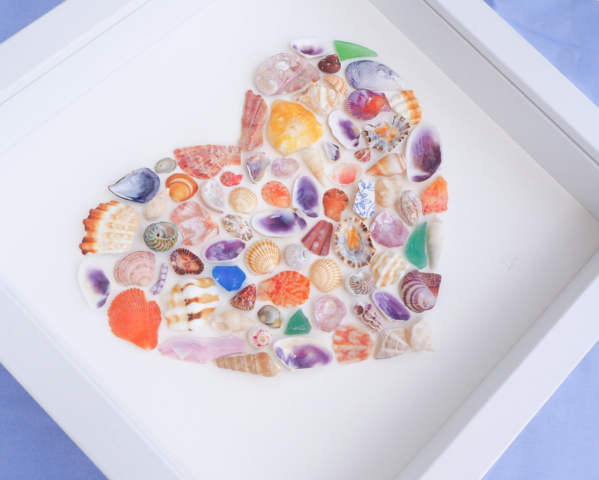 Close up of Rainbow Seashell Heart Artwork with colorful shell handpicked from Portugal. Coastal Home Wall Decor, Shell Wall Art, Handmade Shell Artwork, Cute Coastal Nursery Decoration 