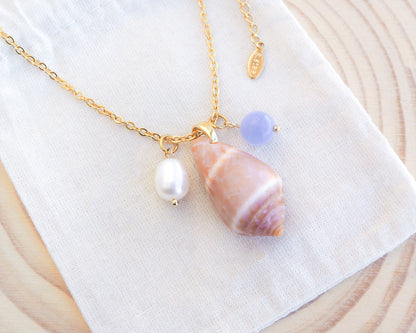 Cone Shell Gemstone Pearl Trio Necklace on display with Cone Shell from Portugal