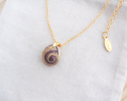Side view of Gold Tritia Neritea Shell Necklace II displayed, handpicked tritia neritea shell from Portugal, 18k gold stainless steel necklace chain 