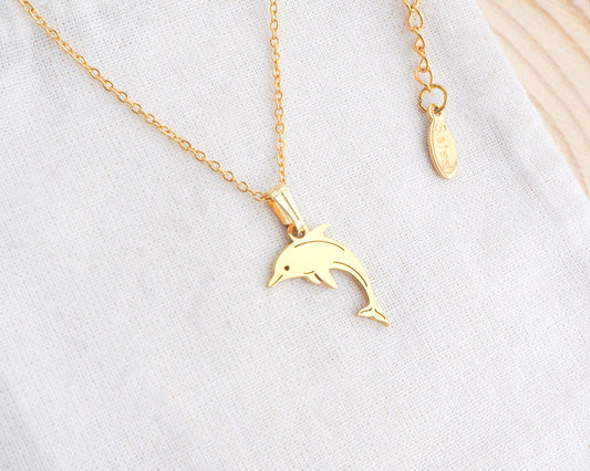 Dolphin Minimalistic Necklace made with 14k gold on display