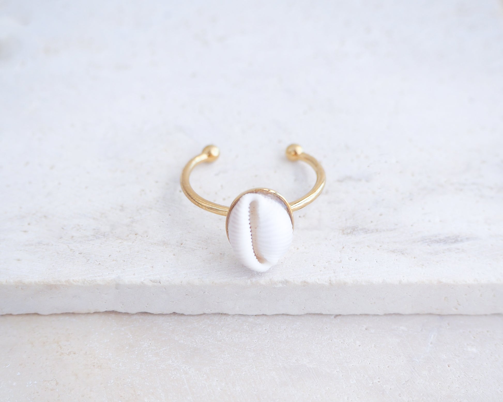 European Cowrie Shell Gold Ring from Portugal on stone display, Handpicked Spotted Cowrie Shell from Portugal, Gold Stainless Steel ring with tiny cowrie shell, Gift for beach girls