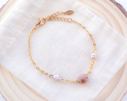 European Cowrie Shell and Freshwater Pearl Gold Bracelet back side on display