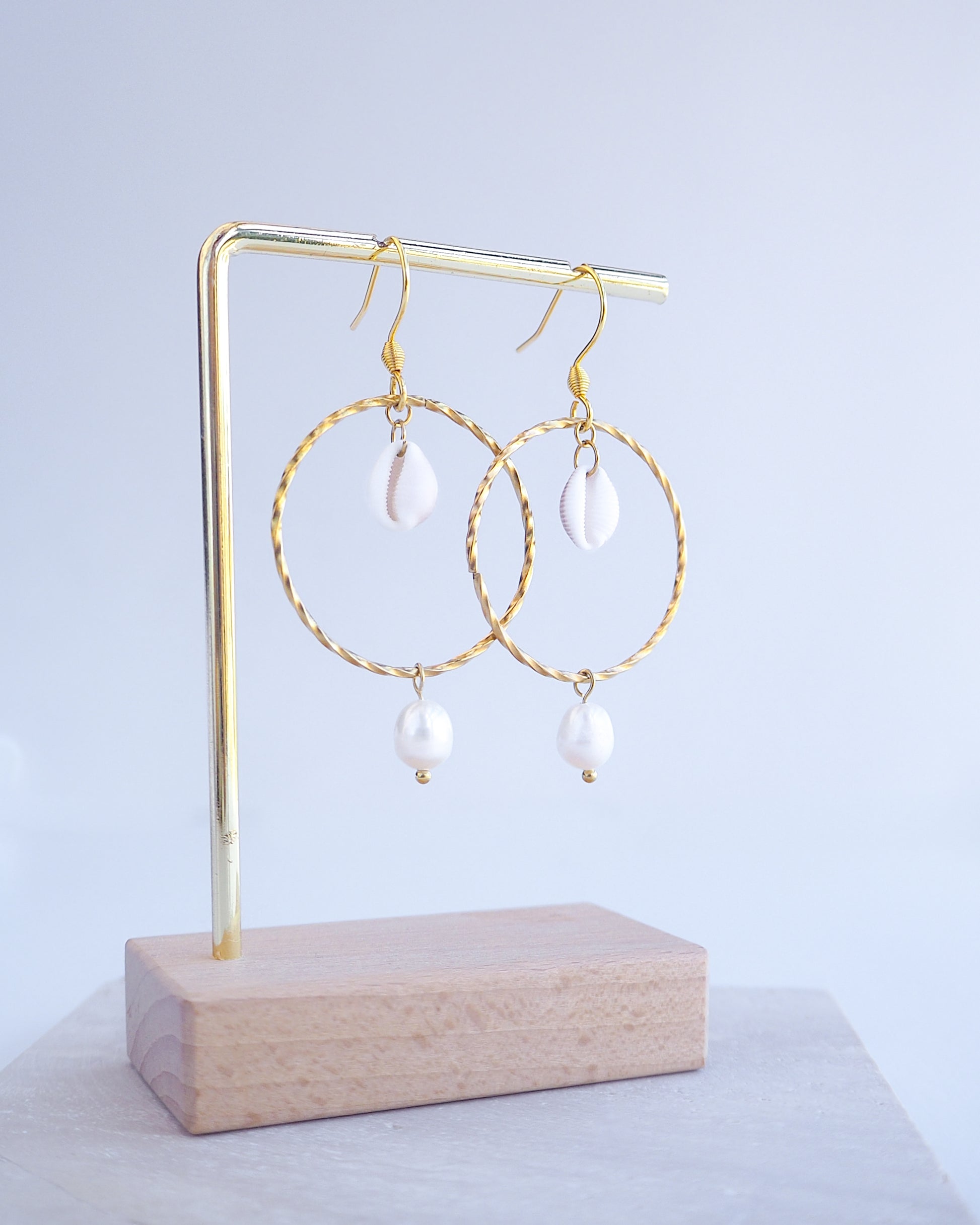 Boho Chic Cowrie Shells Pearl Hoop Earrings on display, 18k Gold Stainless Steel Hoop earrings with tiny cowrie shells handpicked from Portugal. Conchas Beijinhos, Ivory freshwater pearls, seabylou 