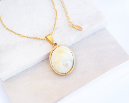 Eye of Saint Lucia Gold Necklace on stone displayed, 18k gold stainless steel shiva eye pendant necklace, Saint Lucy Eye, operculum pendant