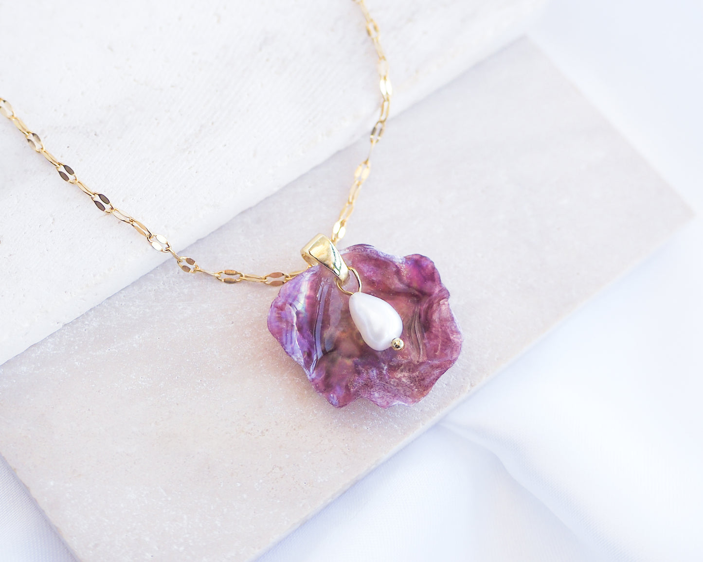 Close up of Fuchsia Pink Pearl Shell Necklace VII displayed on stone, Gold Pearly Pink Oyster Shell Necklace, Fuchsia Pink Pearly Shell handpicked from Portugal, Sea by Lou, Mother of Pearl Shell Portugal 