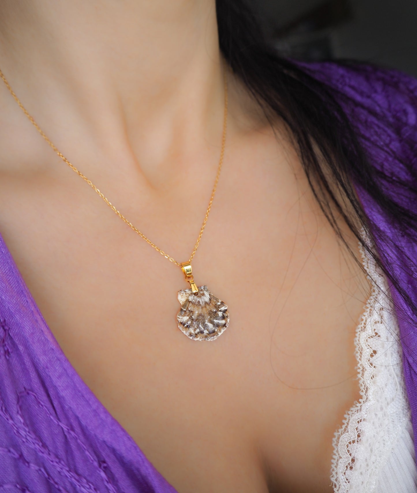 Gold Brown White Scallop Shell Necklace on neck model with purple dress, Brown White Leopard Scallop Shell from Portugal, 18k gold stainless steel chain, Flexopecten flexuosus shell necklace