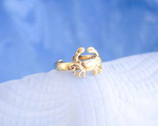 Gold Cancer Zodiac Ring with blue white background displayed, adjustable 18k gold stainless steel crab ring 