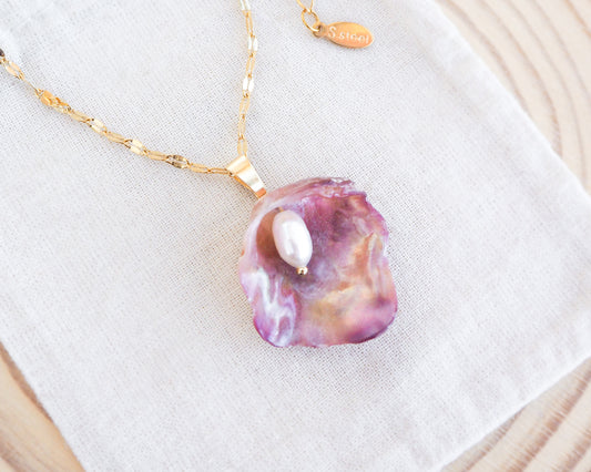 Fuchsia Pink Pearly Shell Necklace, Gold Jingle Shell Necklace on display side view, Sea by Lou, Mother of Pearl Shell Portugal 