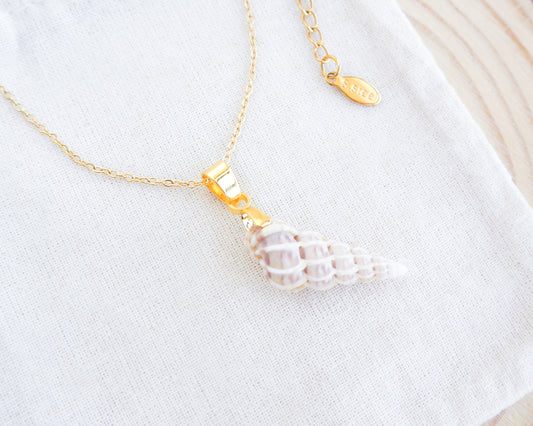 Gold Ivory Wentletrap Necklace on display