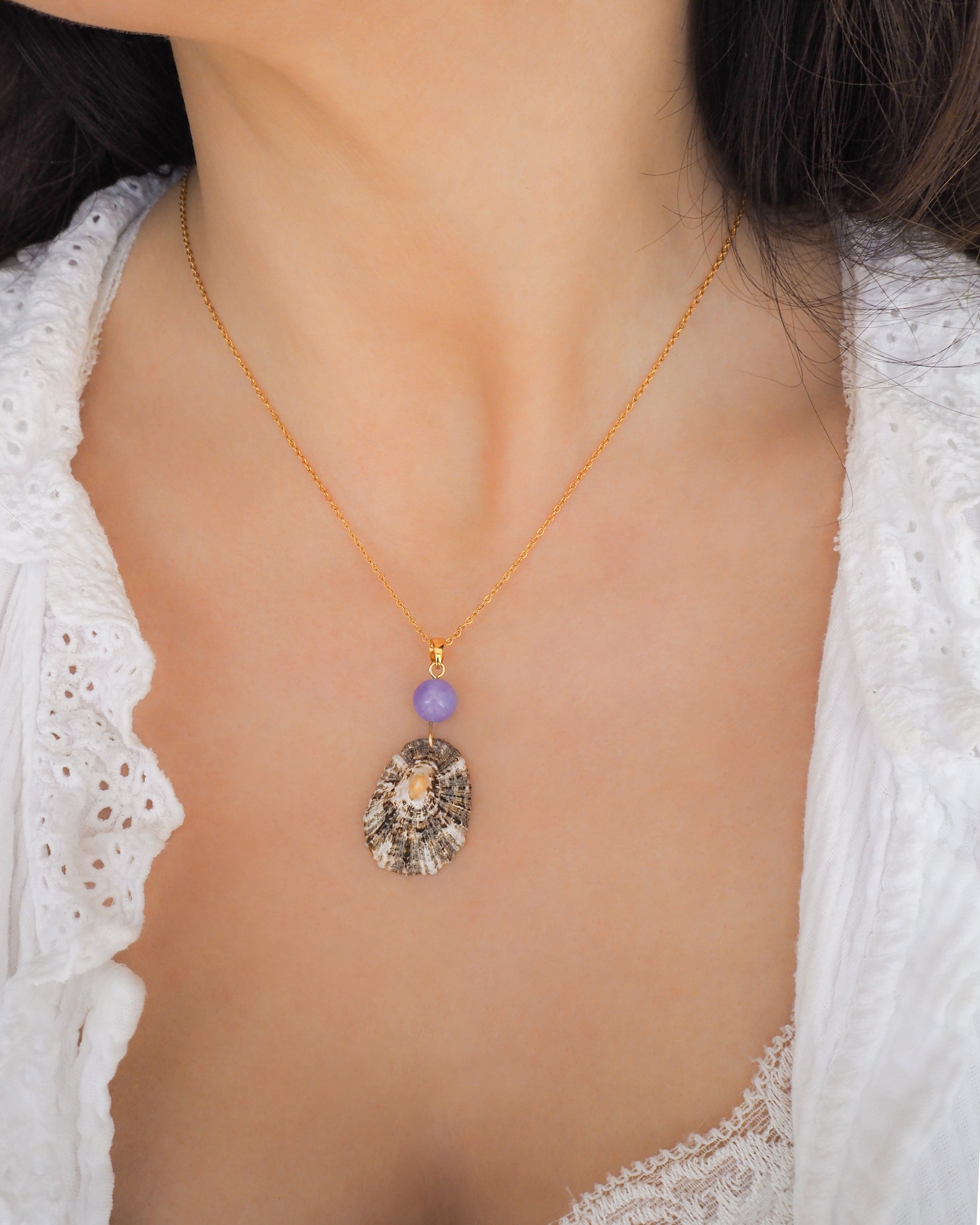 Gold Limpet Shell Necklace with Blue Angelite Gemstone on neck model