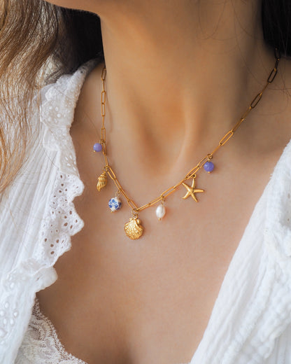 Oceanic Charm Necklace with Shells and Starfish Pendants, Freshwater Pearls and Gemstones on neck model