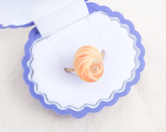 Orange Yellow Eye of Saint Lucia Shell Gold Ring in blue seashell jewelry box front view, Handcrafted Orange Shiva Eye Ring, Real Shiva Eye from Portugal, Handpicked eye of saint lucia, gold stainless steel ring