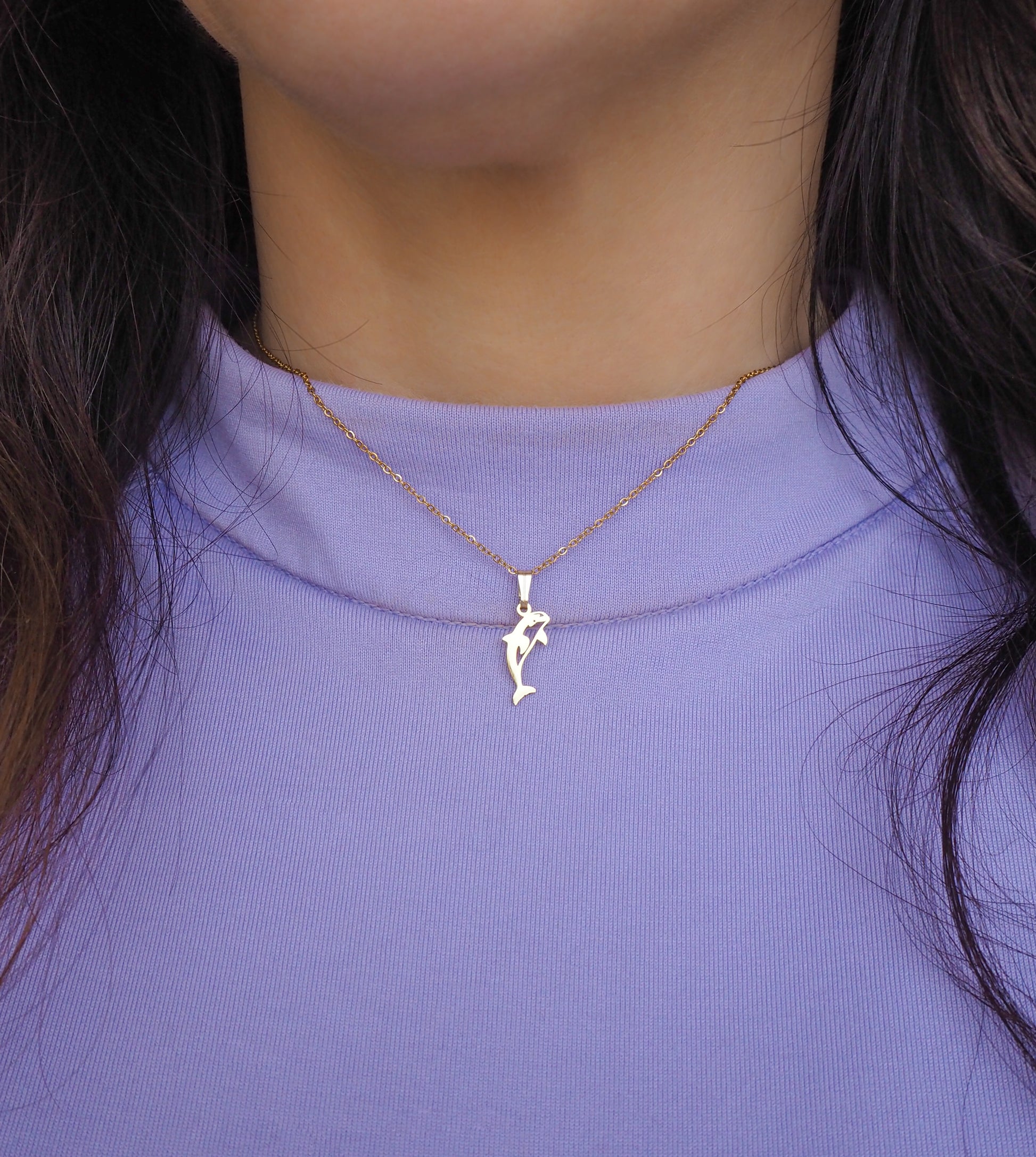 Gold Orca Killer Whale Necklace on neck model with sweater