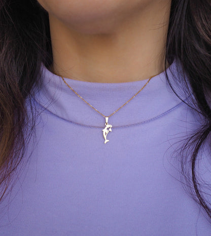 Gold Orca Killer Whale Necklace on neck model with sweater