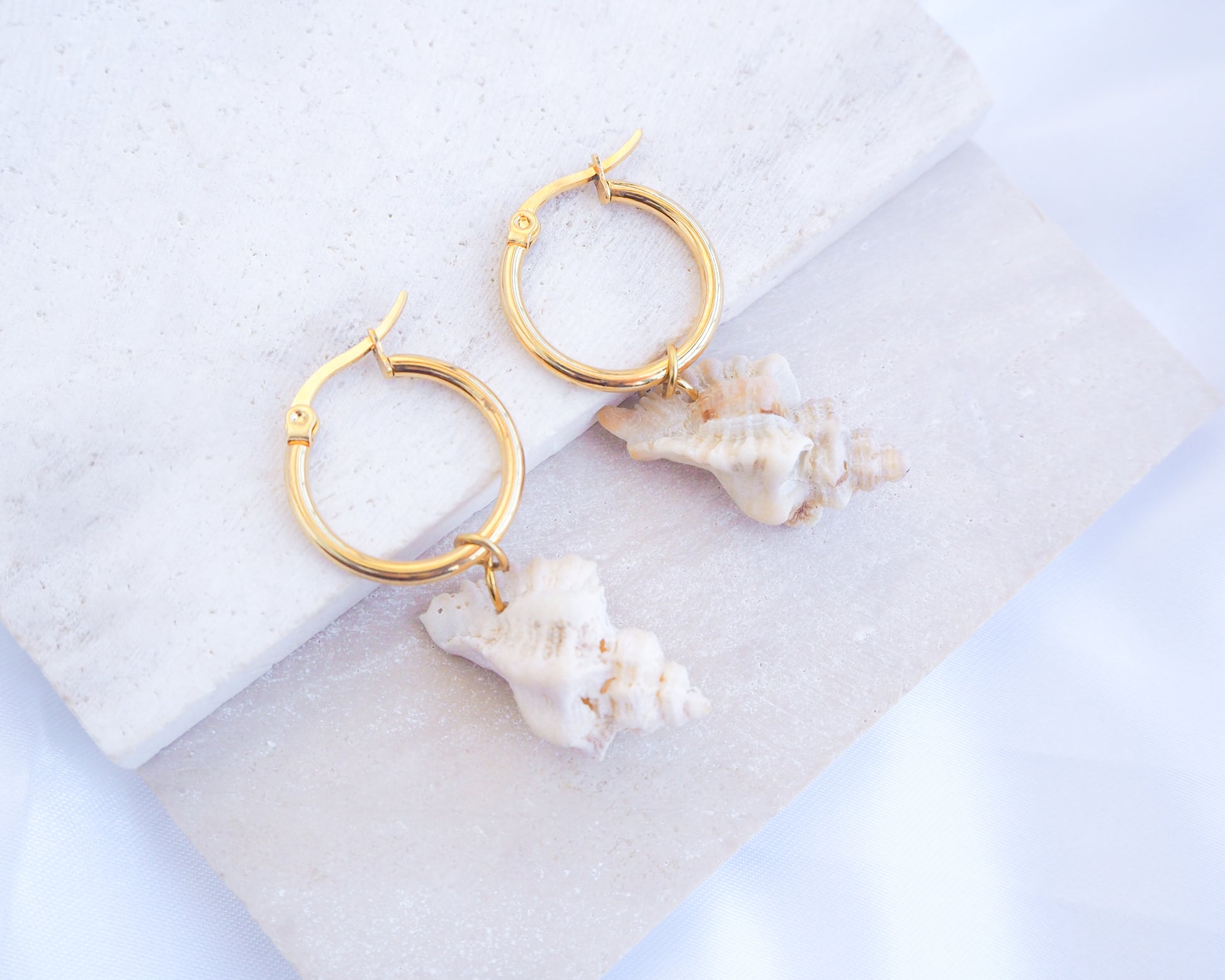 Gold Sting Winkle Shell Hoop 20mm Earrings from Portugal on display