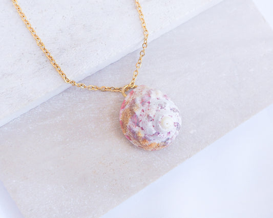 Sunny Pink White Orange Magus Top Shell Gold Necklace on stone display side view