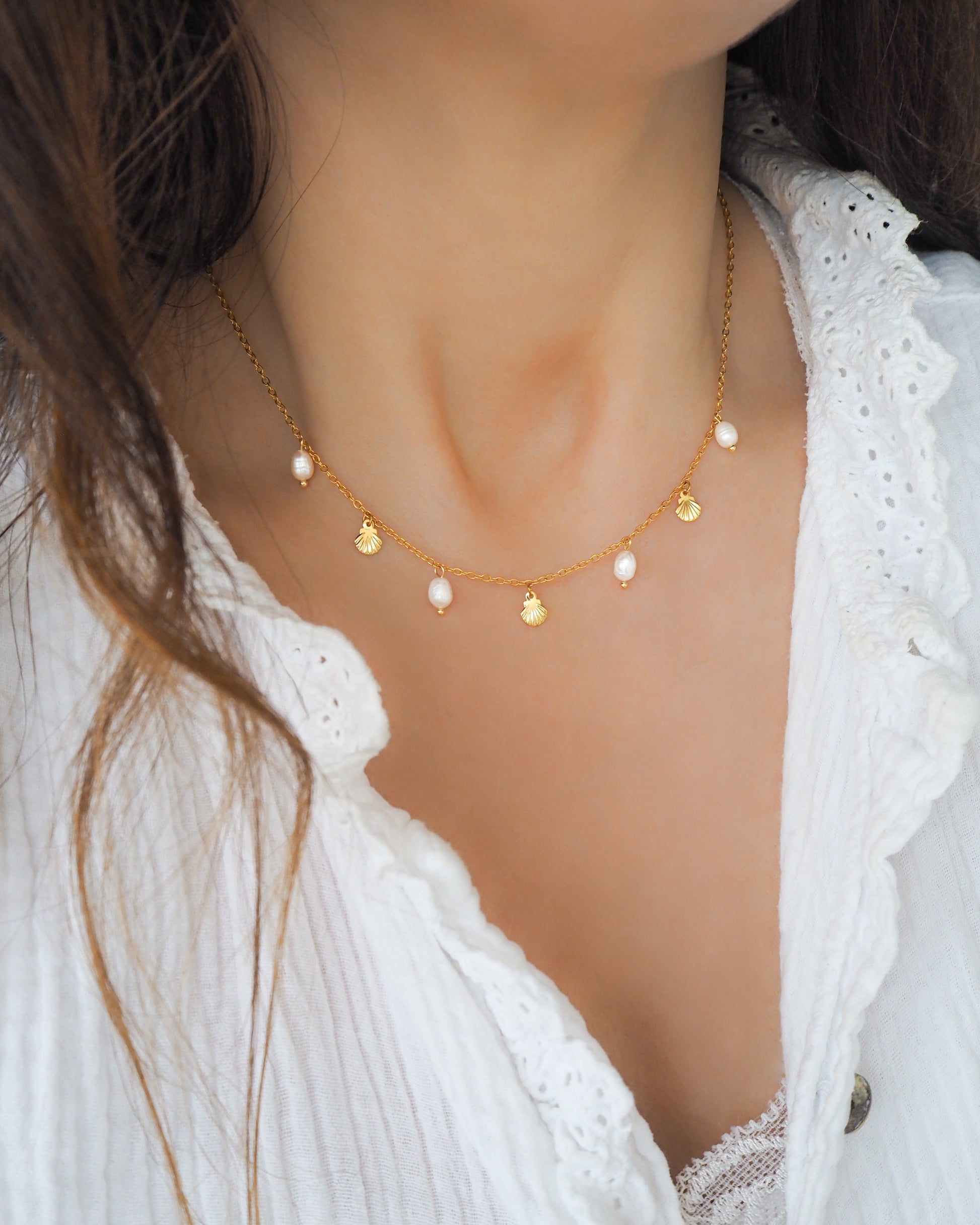 Gold Tiny Shell with Freshwater Pearls on model