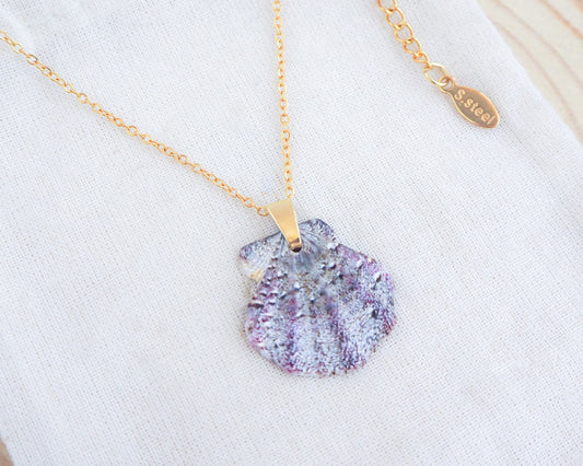 Gold Scallop Shell Necklace with Grey Leopard Scallop Shell on display