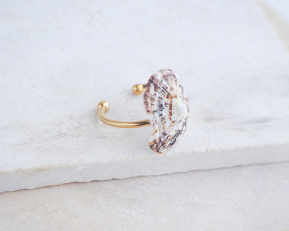 Side view of Limpet Shell Gold Adjustable Ring from Portugal on stone displayed