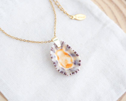 Front view of Gold Limpet Shell Upside Down Necklace with orange center on display. Limpet Shell from Portugal, Lapa Concha 