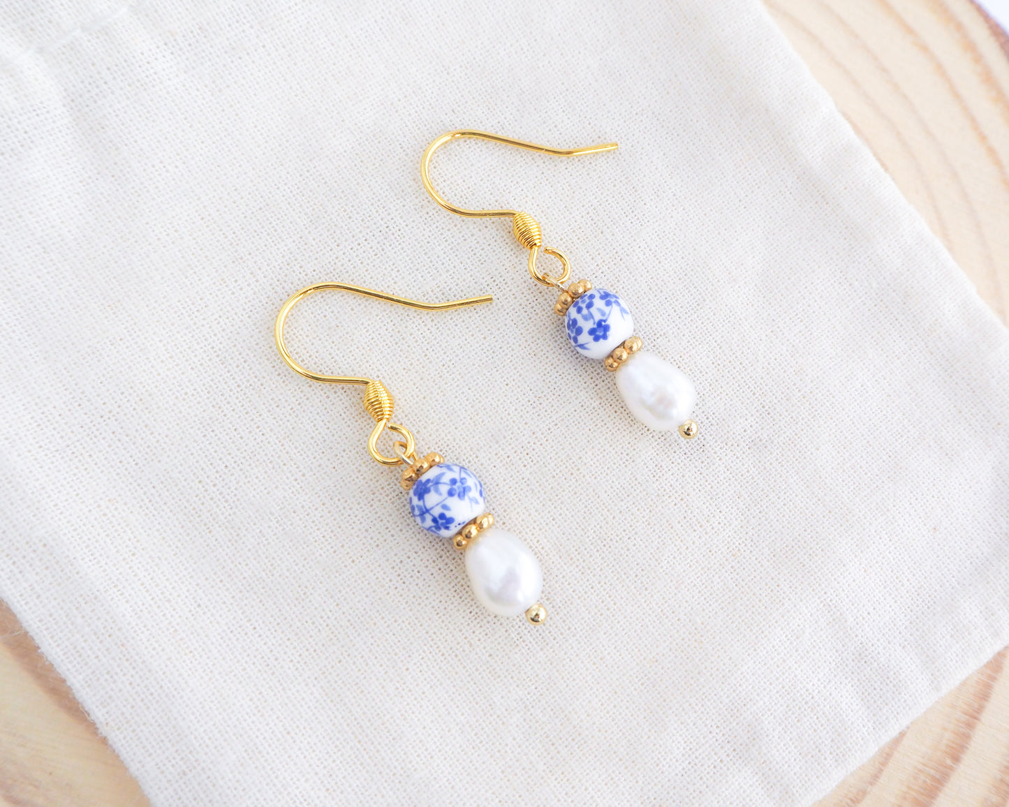 Portuguese Ceramic Pearl Gold Earrings Mini Azulejo Earrings from Portugal on display. Mini Azulejo Earrings from Portugal, Portuguese Tlles Jewelry, Blue White Flower Porcelain Earrings