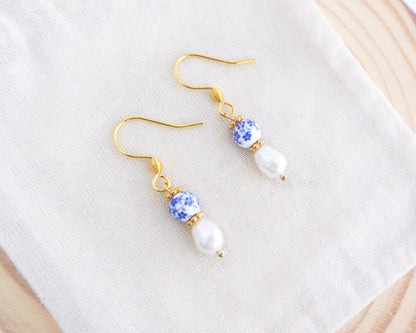 Portuguese Ceramic Pearl Gold Earrings Mini Azulejo Earrings from Portugal on display. Mini Azulejo Earrings from Portugal, Portuguese Tlles Jewelry, Blue White Flower Porcelain Earrings