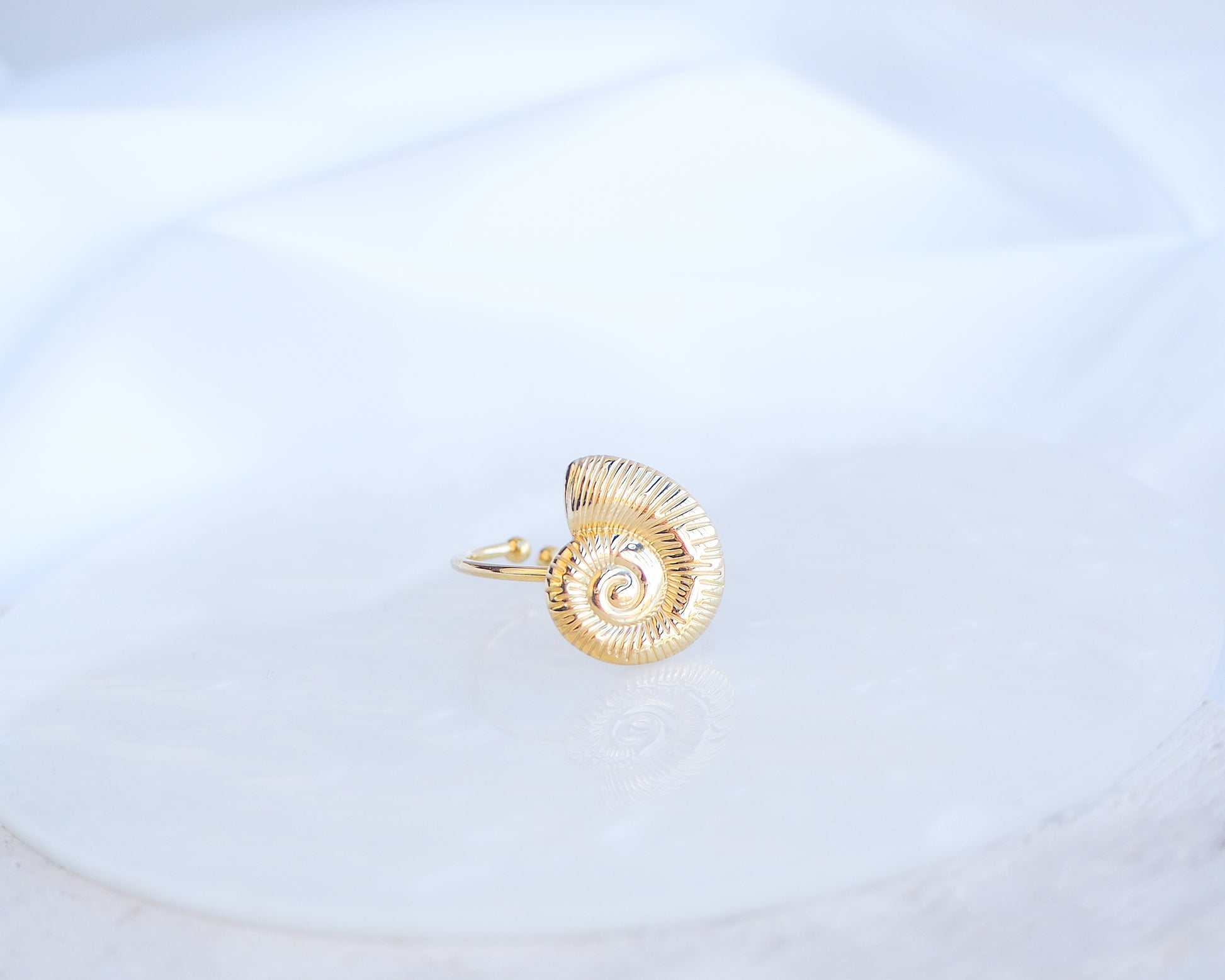 Front view of Gold Nautilus Seashell Ring displayed, adjustable 18k gold stainless steel shell ring 