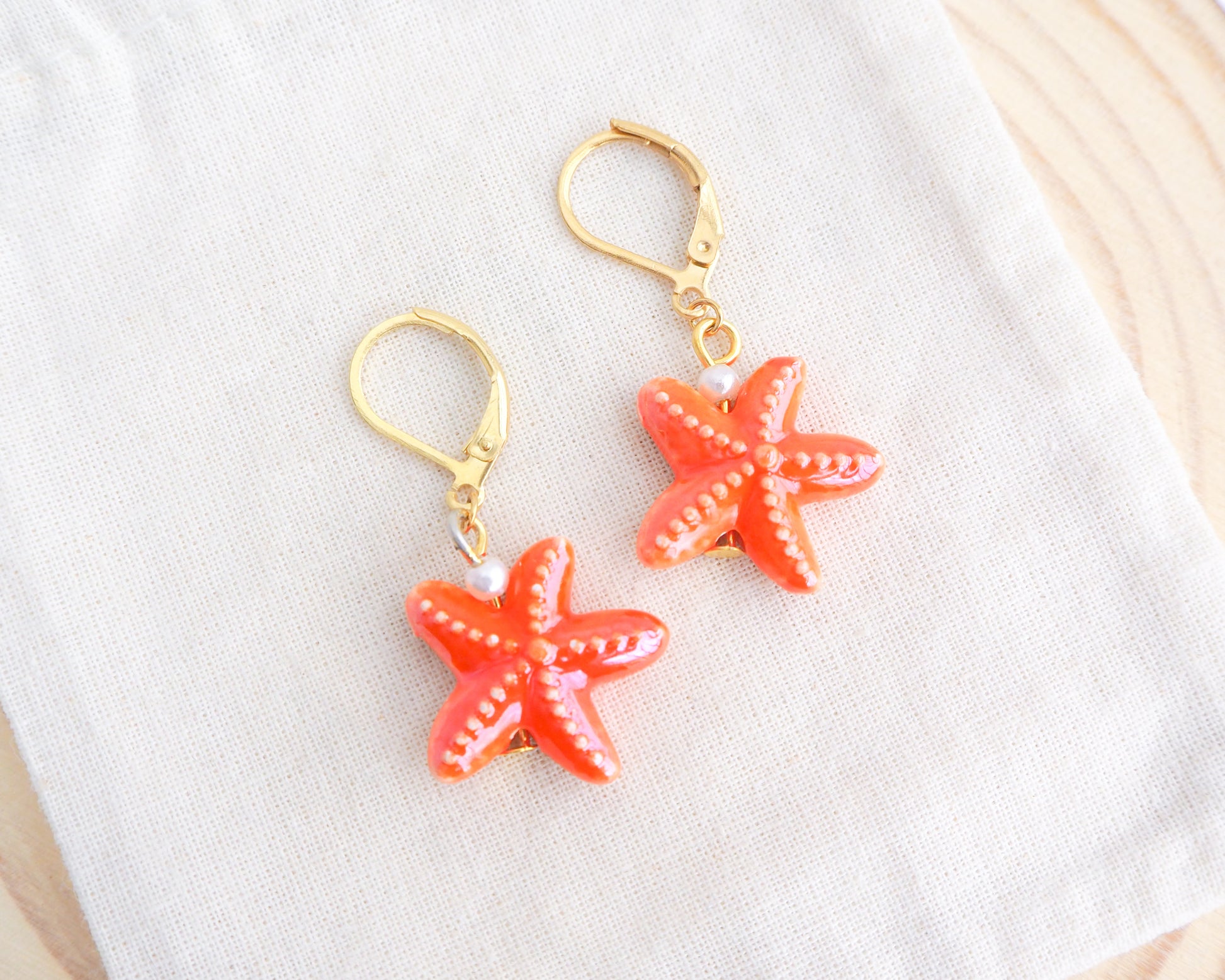 Orange Ceramic Starfish Sea Star Gold Earrings on display, Orange Starfish Summer earrings