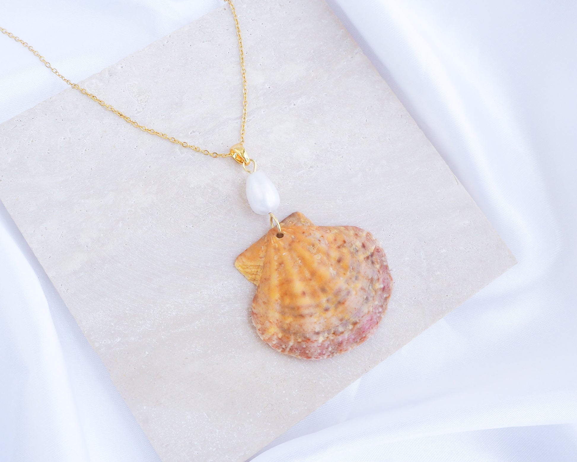 Orange Pink Scallop Shell Pearl Gold Necklace on stone displayed, Scallop Shell handpicked from Portugal 