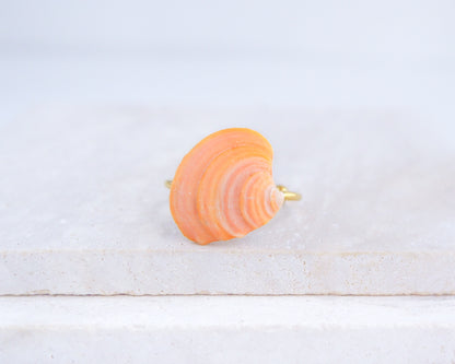 Orange Shell Ring from Portugal displayed on stone front view, colorful orange shell gold ring