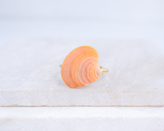 Orange Shell Ring from Portugal displayed on stone front view, colorful orange shell gold ring