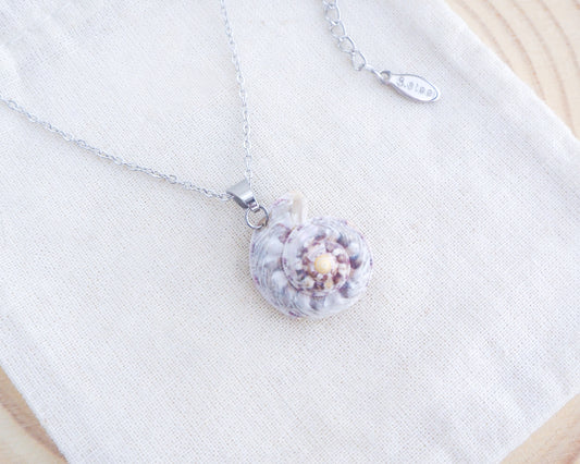 Pearly Silver Magus Top Shell Necklace on display
