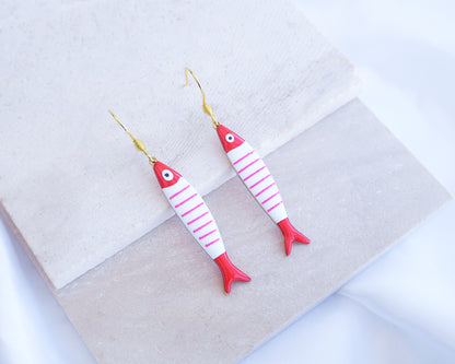 Nautical Striped Sardine Fish Earrings with 14k gold stainless steel earring hooks displayed on stone, Red Pink White Striped Fish Pendant, Beautiful gift for Portugal lovers or holiday memory, coastal jewelry from Portugal
