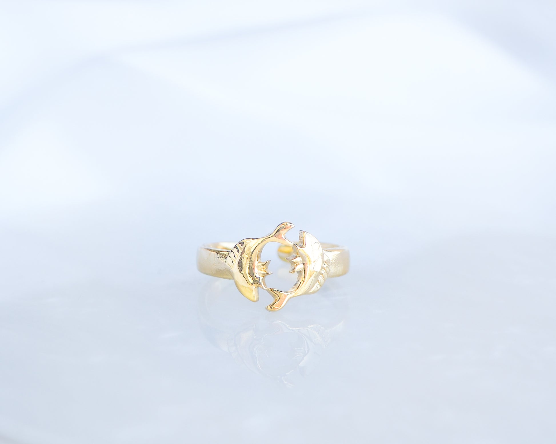 Front view of Gold Pisces Zodiac Ring on display, adjustable 18k gold stainless steel Fish ring 
