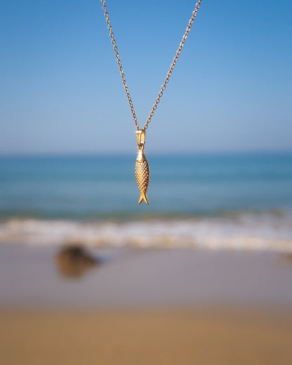 Gold Sardine Fish pendant necklace with ocean view background, Sardine Fish Necklace, Christian Fish Jewelry, Pisces Zodiac Gift, Portuguese Sardine Jewelry, Gift for Portugal Lovers, 