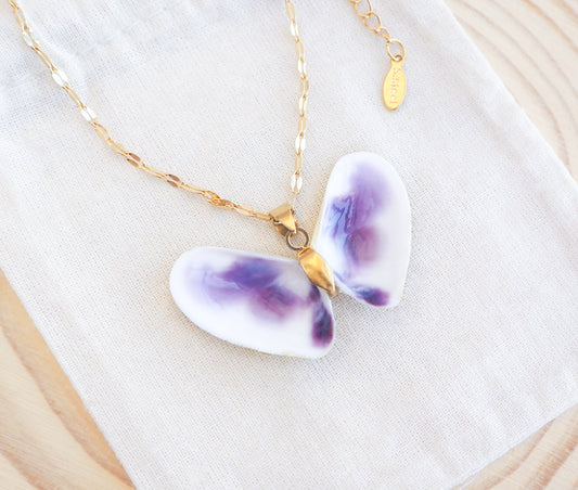 Purple Coquina Sea Butterfly Shell Necklace XII with gold deluxe chain necklace on display