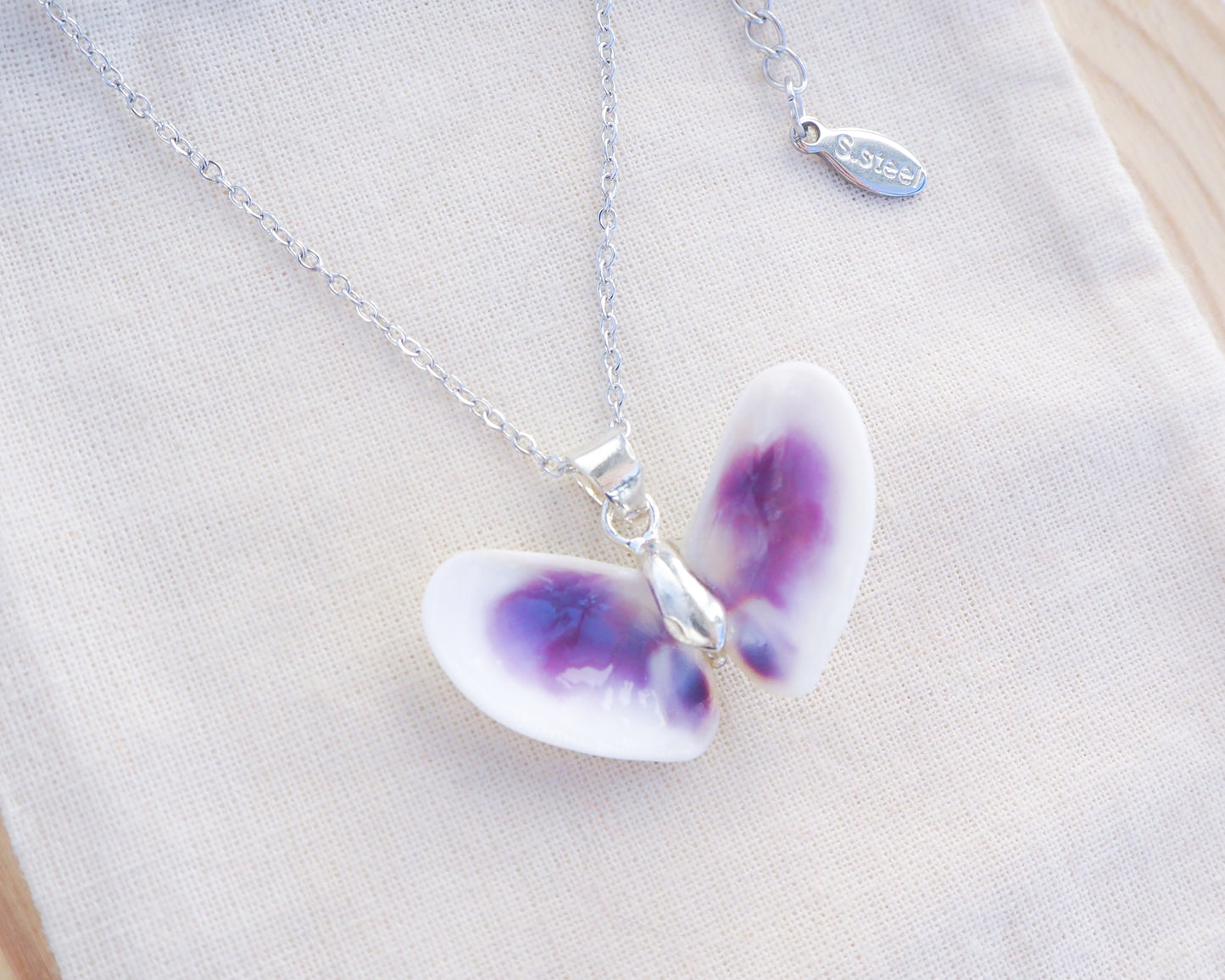 Purple Coquina Shell Butterfly Silver Necklace IV on display