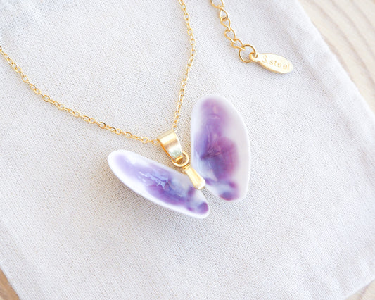 Purple White Coquina Butterfly Shells Gold Necklace XI on display 